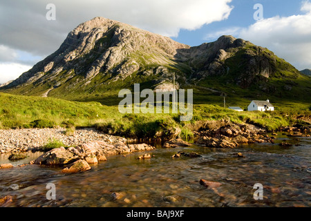 View across the River Coupall towards the towering peaks of Buchaille Etive Mor in early evening light Scotland Stock Photo