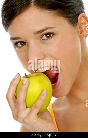 junge Frau in Sportdress mit Apfel, Girl holding a green apple Stock Photo