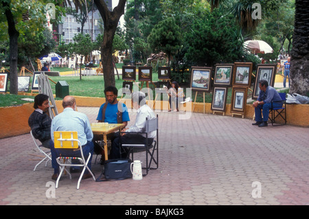 Men playing dominoes in Sullivan Park Jardin del Arte Sunday art show in Mexico City Stock Photo