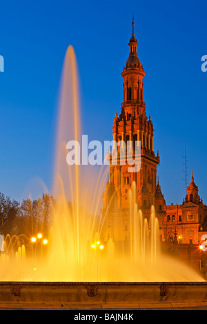 Tower and fountain at the Plaza de Espana,Parque Maria Luisa,during dusk in the City of Sevilla (Seville),Province of Sevilla. Stock Photo