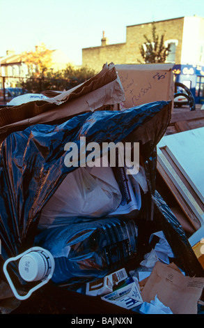 Non-recyclable plastic waste in rubbish skip South London England Stock Photo