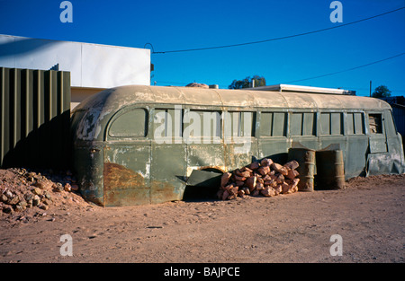 Ruined old bus going nowhere, Andamooka opal mining town, South Australia Stock Photo