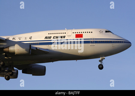 Air China Boeing 747-400 jumbo jet plane arriving at dawn. Close up view. Stock Photo