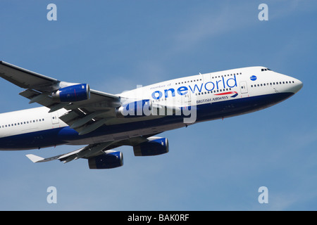 BA British Airways Boeing 747 jumbo jet taking off with OneWorld One World group titles Stock Photo