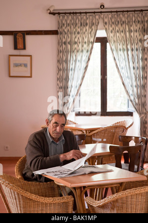 Old man reading newspaper in cafe Arta Mallorca Spain Stock Photo