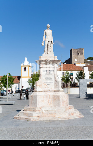 Dom Pedro V Square in Castelo de Vide, Portugal. Dom Pedro V statue with the Castle and Sao Joao Baptista Church in the back. Stock Photo