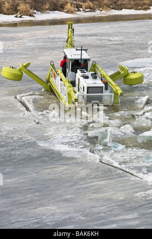 Amphibex Icebreaker machine breaking up ice jams on the Red River, near Selkirk, Manitoba, Canada. Stock Photo