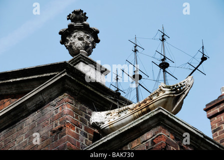 Stone ship on exterior of Trinity Green Almshouses in Mile End Road Whitechapel London. Stock Photo