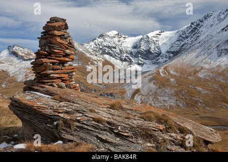 France, Savoie, Le Clou hamlet (2226m), piled stones on the way to the Clou Lake, the Pointe des Mines and the upper side of Stock Photo