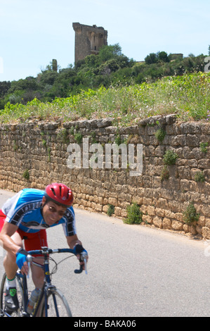 cyclist the ruin chateauneuf du pape rhone france Stock Photo