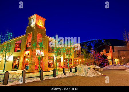 The BrewHouse at Whistler Restaurant and Pub with trees lit up with decorative lights at night along the Village Stroll,Whistler Stock Photo