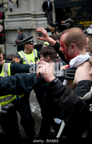 Anti-Capitalist protesters gathered at the Bank of England on the eve of the G20 Summit, which turned violent with police Stock Photo