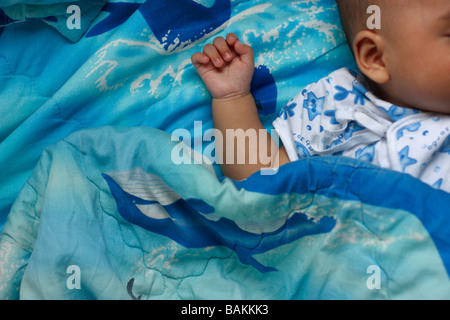 A sleeping five month old baby boy. Stock Photo