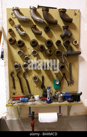 pumping tools hanging on a wall domaine giraud chateauneuf du pape rhone france Stock Photo