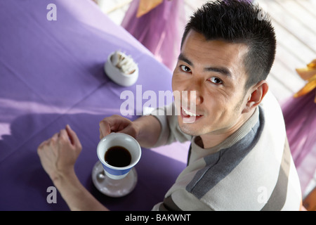 Man Drinking A Cup Of Coffee Stock Photo