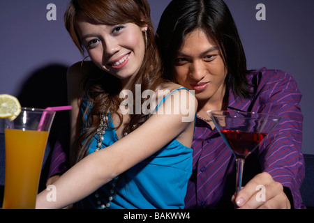 Couple Drinking In Bar Together Stock Photo