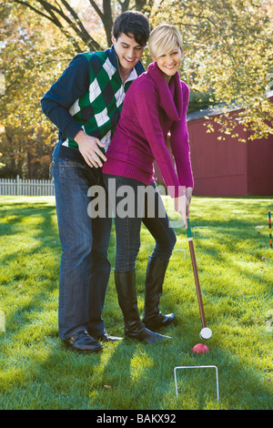 Young couple playing croquet Stock Photo