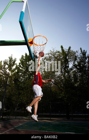 Basketball Player Shooting Hoops Stock Photo