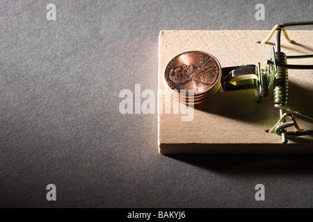 Coins on mousetrap