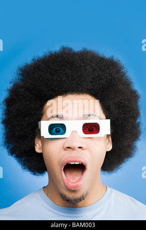 A young man wearing 3d glasses Stock Photo