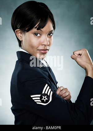 Portrait of an air woman flexing her muscles Stock Photo