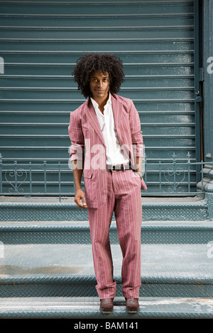 Young man wearing striped suit Stock Photo