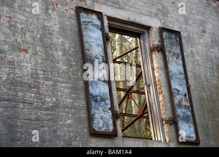 rust rusty iron steel shutters brick wall antique ruin building old horizontal abandoned empty vacant shutter view open exterior Stock Photo