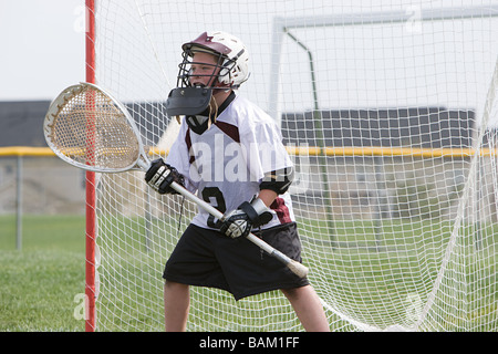 Junior lacrosse player in goal Stock Photo