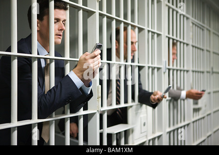 Businessmen in jail Stock Photo