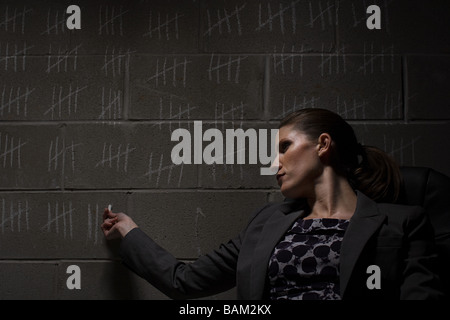 Businesswoman and chalk marks on wall Stock Photo