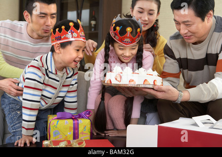 Family Celebrating Girl's Birthday Stock Photo