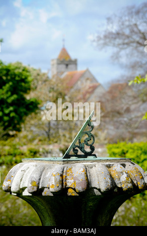 A sundial at Firle Place near Lewes with Firle Church in background, East Sussex, UK. Picture by Jim Holden. Stock Photo