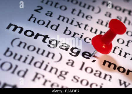 Thumb tack on word mortgage Stock Photo