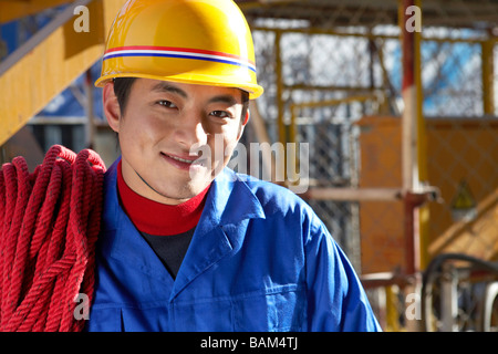 Worker Wearing Hard Hat In Construction Site Stock Photo
