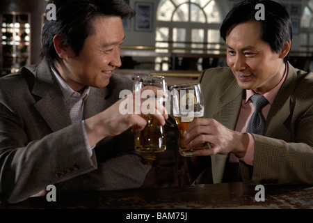 Businesspeople Toasting With Beer Stock Photo