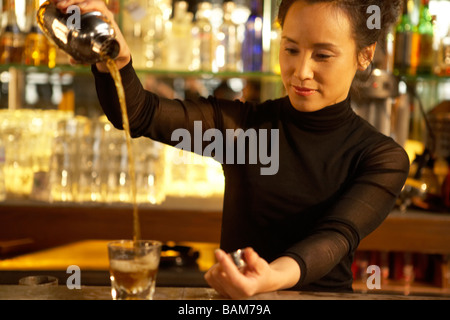 Bartender Pouring Drink Stock Photo