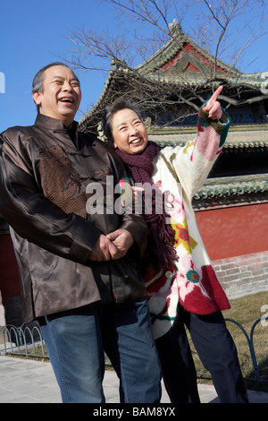 Happy Elderly Couple Looking In The Distance Stock Photo