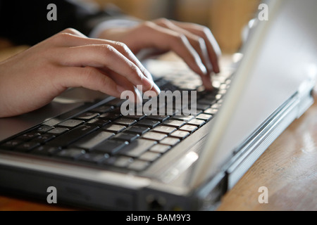 Man Typing On Laptop Computer Stock Photo