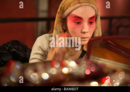 Woman Applying Make-Up With Brush Stock Photo