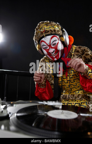Man In Ceremonial Costume Using Turn-Tables Stock Photo