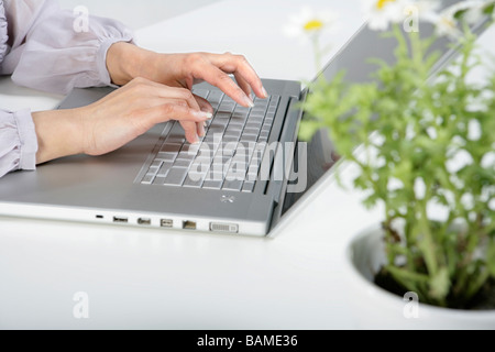 Person Typing On Laptop Stock Photo