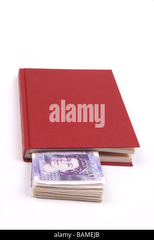 Stack of British money inside book Stock Photo