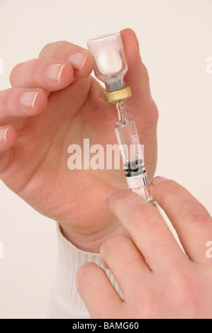 Person preparing an injection Stock Photo