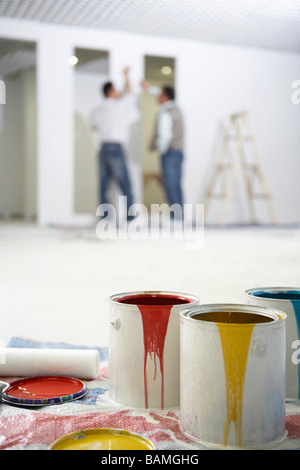 Close-Up Of Paint Buckets In A House Stock Photo