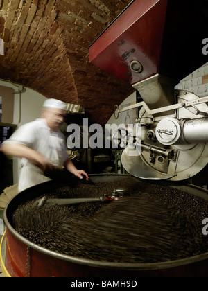 An employee of Pasticceria Sandri roasts coffee on site at the bakery. Stock Photo