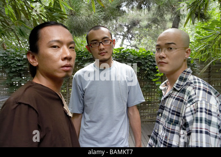 Three Young Mans Looking At Camera Stock Photo
