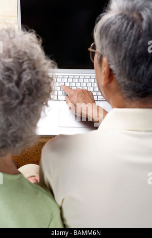 Elderly Couple Using A Computer Together Stock Photo