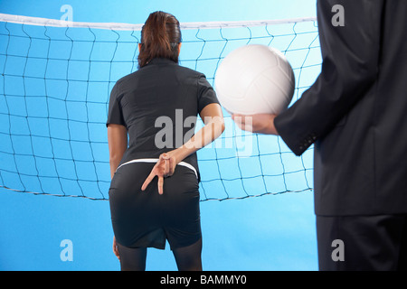 Young Adults Playing Volleyball Stock Photo