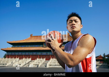 Portrait Of Young Basketball Player In Front Of Temple
