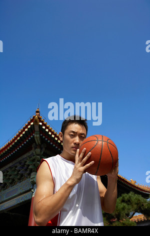 Portrait Of Young Basketball Player In Front Of Temple